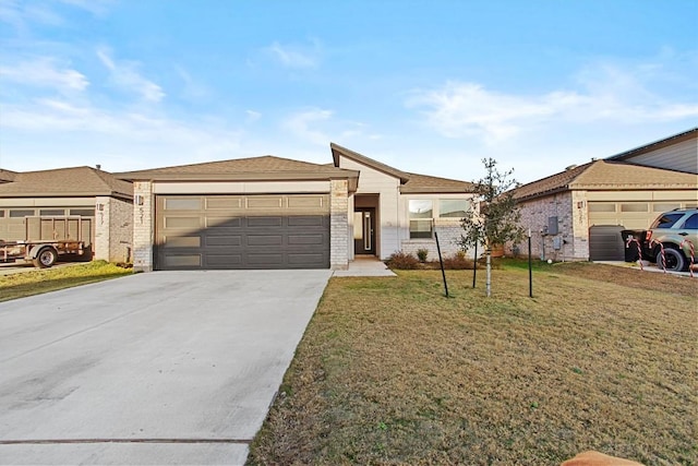 view of front of property with a garage and a front lawn