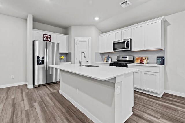 kitchen with sink, white cabinets, and appliances with stainless steel finishes