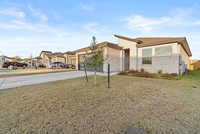 view of front of property with a garage and a front lawn