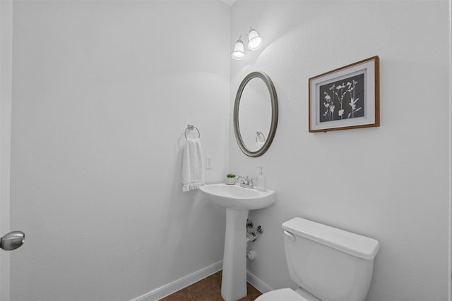 bathroom with tile patterned flooring and toilet