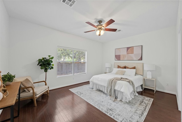 bedroom with ceiling fan and dark wood-type flooring