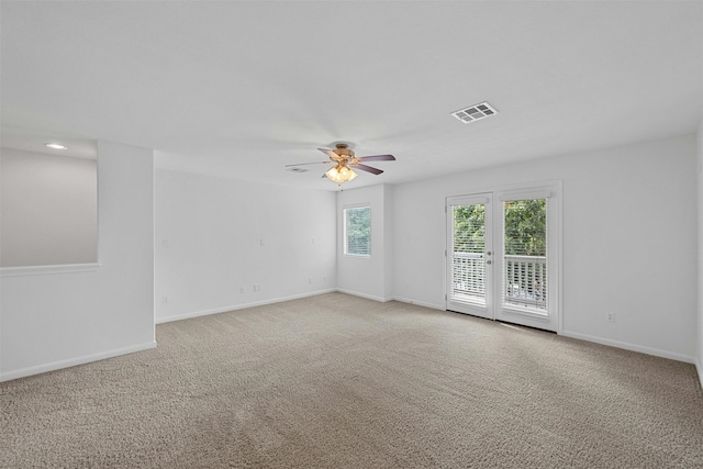 unfurnished room featuring ceiling fan and light colored carpet