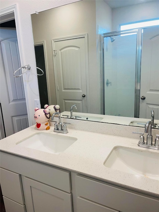 bathroom with vanity and an enclosed shower