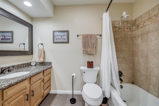 full bathroom with tile patterned floors, shower / bath combo with shower curtain, vanity, and toilet