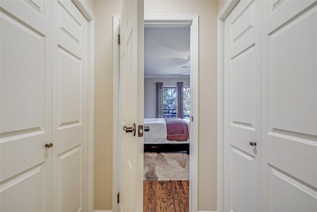 corridor featuring wood-type flooring