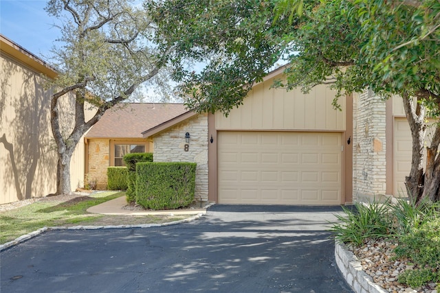 ranch-style house featuring a garage