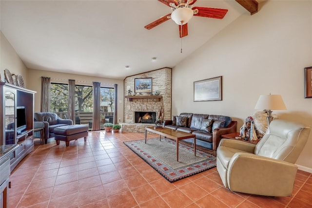 living area featuring light tile patterned flooring, a fireplace, beam ceiling, and a ceiling fan