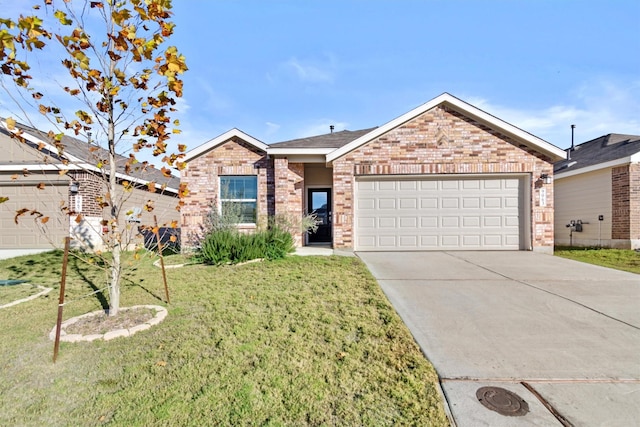 view of front of property featuring a garage and a front lawn