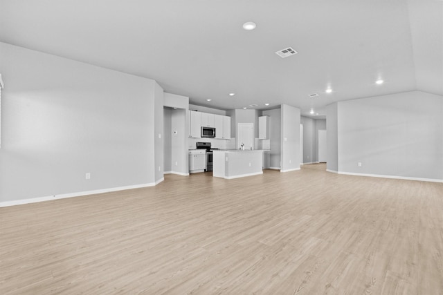 unfurnished living room with light hardwood / wood-style flooring