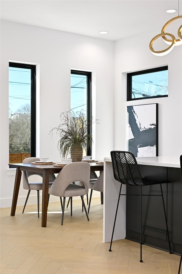 dining room featuring light parquet flooring