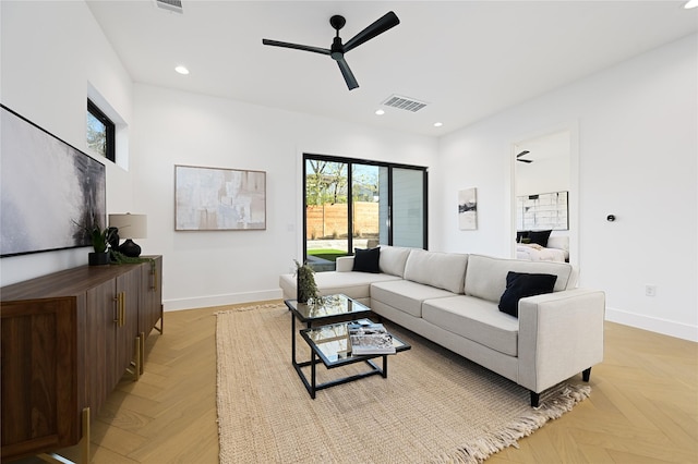 living room with ceiling fan and light parquet floors