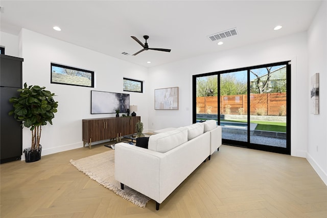 living room with ceiling fan and light parquet floors