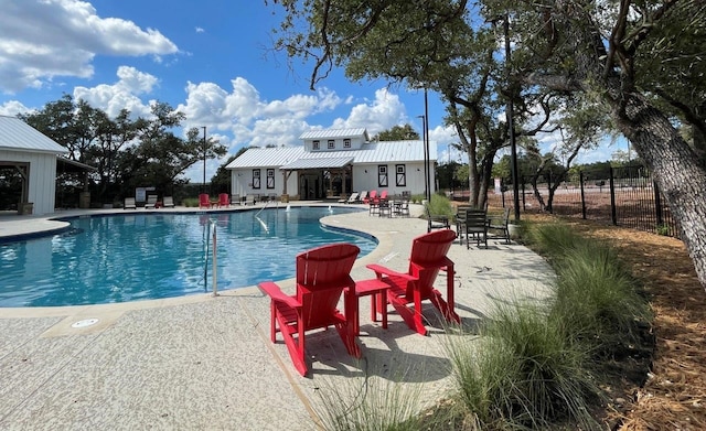 view of pool featuring a pergola and a patio