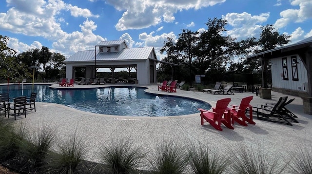 view of pool featuring a patio