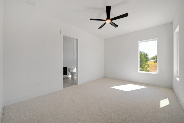 carpeted empty room with ceiling fan