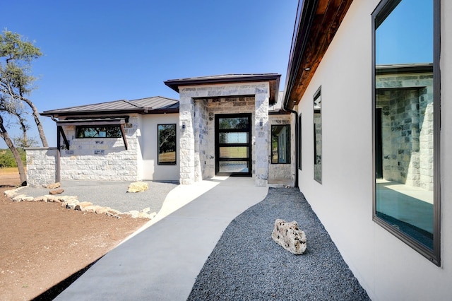 doorway to property featuring a patio area