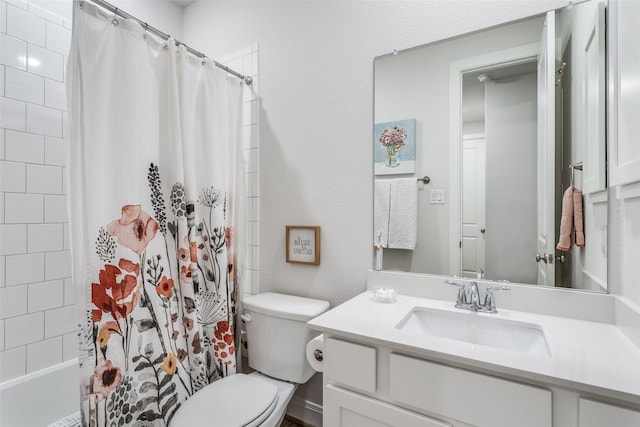 full bathroom featuring shower / bath combo, vanity, and toilet