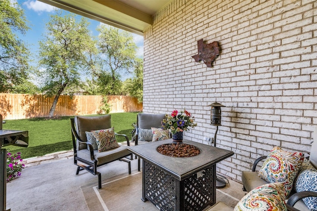 view of patio featuring an outdoor living space with a fire pit