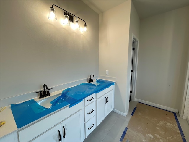 bathroom with vanity and tile patterned flooring