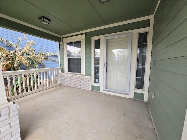 doorway to property with covered porch