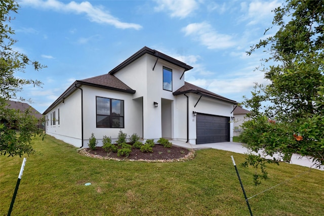 view of front of house featuring a garage and a front yard