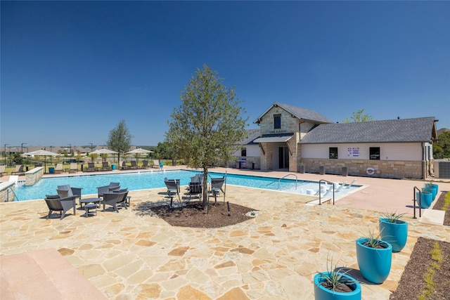 view of swimming pool featuring a patio area