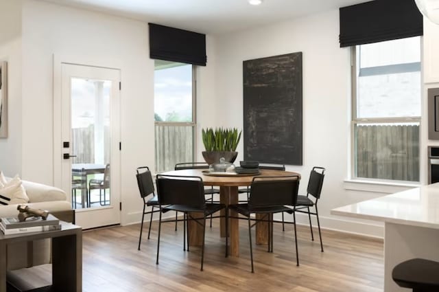 dining area with light wood-type flooring