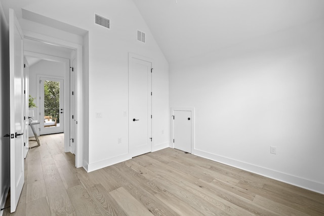 interior space featuring high vaulted ceiling and light hardwood / wood-style floors