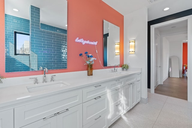 1604 Miriam Ave, Austin, TX 78702 - full bathroom with double vanity and recessed lighting