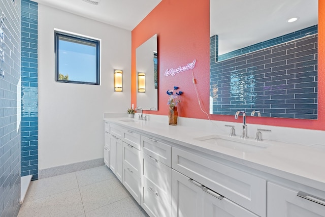 1604 Miriam Ave, Austin, TX 78702 - bathroom featuring double vanity, baseboards, and recessed lighting