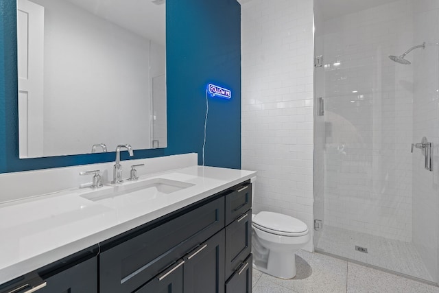 1604 Miriam Ave, Austin, TX 78702 - bathroom with vanity, a shower stall, toilet, and speckle patterned floor
