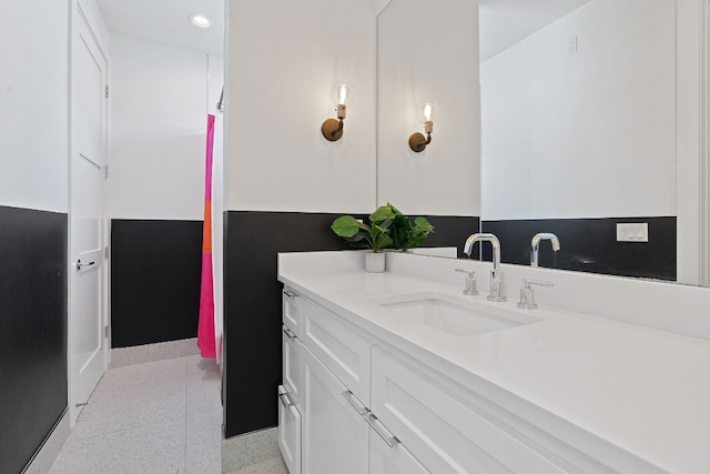 1604 Miriam Ave, Austin, TX 78702 - bathroom featuring vanity, baseboards, and recessed lighting