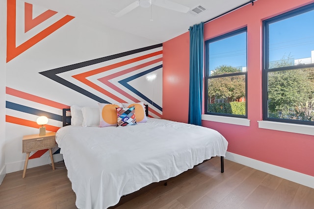 bedroom featuring hardwood / wood-style flooring and ceiling fan