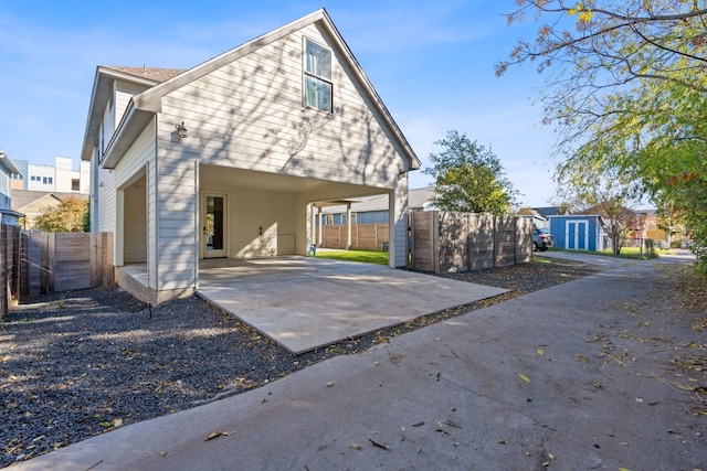 1604 Miriam Ave, Austin, TX 78702 - view of side of property with a carport and driveway