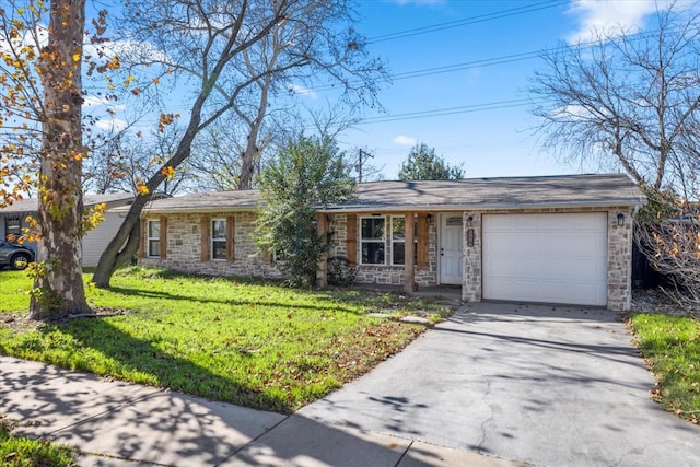 ranch-style house featuring a garage and a front lawn