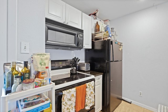 715 22 1/2 St Unit 101, Austin, TX 78705 - kitchen featuring black appliances, white cabinetry, light tile patterned floors, and dark countertops