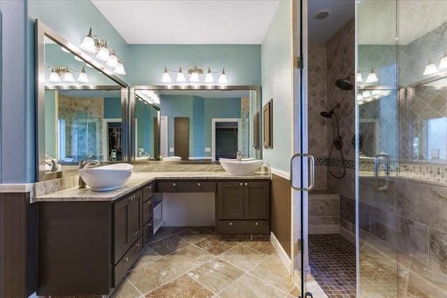 bathroom with a shower with door, wooden walls, and vanity