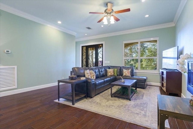 living room featuring ornamental molding, ceiling fan, and wood-type flooring