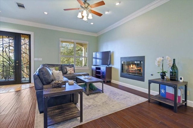 living room with ceiling fan, ornamental molding, and hardwood / wood-style floors