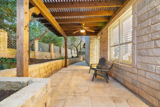 view of patio / terrace featuring ceiling fan and a pergola