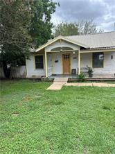 view of front of home with a front yard and a porch