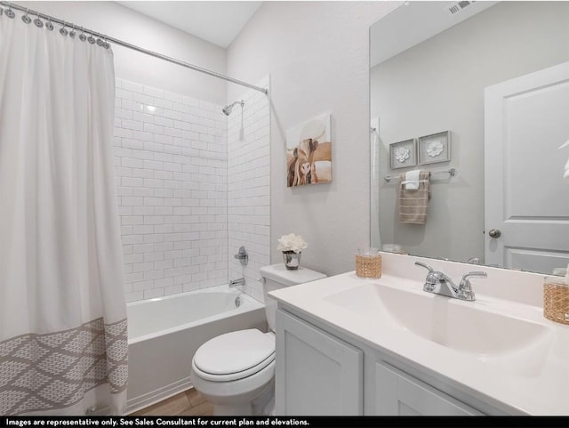 bathroom featuring vanity, toilet, visible vents, and shower / tub combo with curtain