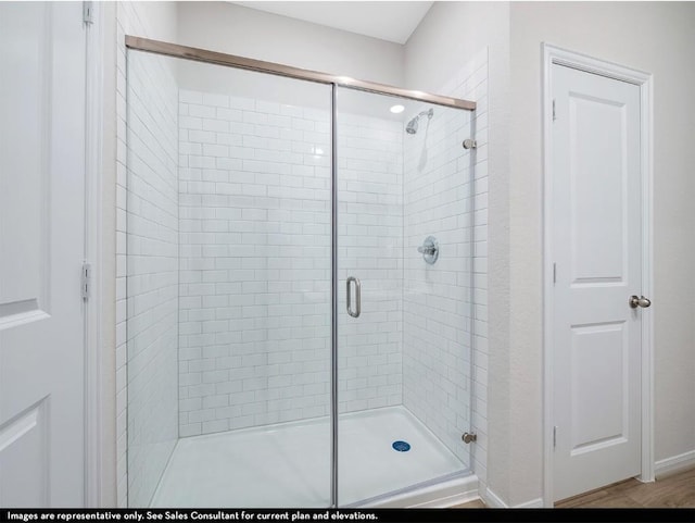 full bathroom with a shower stall