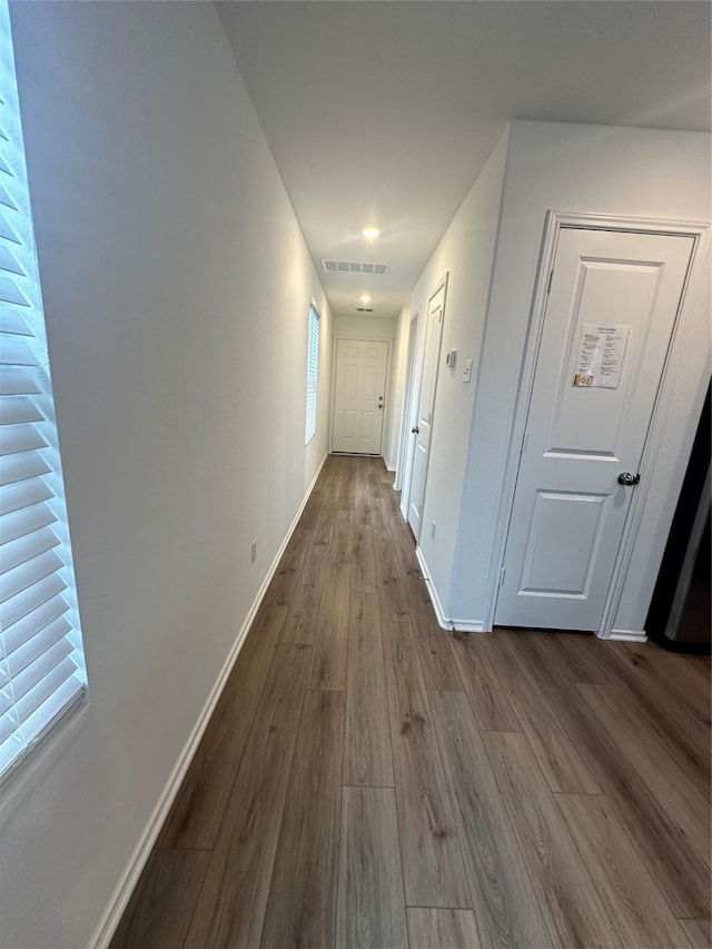 corridor featuring hardwood / wood-style flooring