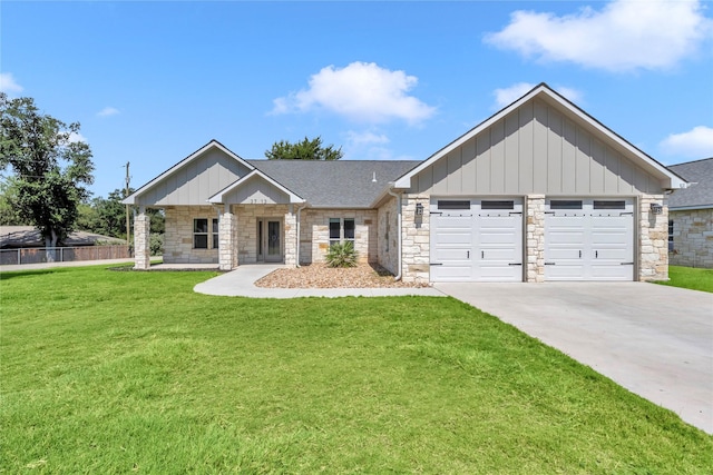 craftsman-style house featuring a front yard and a garage