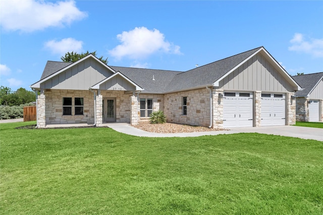 view of front of home with a garage and a front lawn