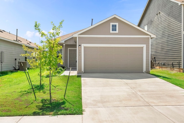 view of front of home with central AC and a front lawn