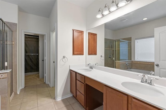 bathroom with tile patterned floors, vanity, and independent shower and bath