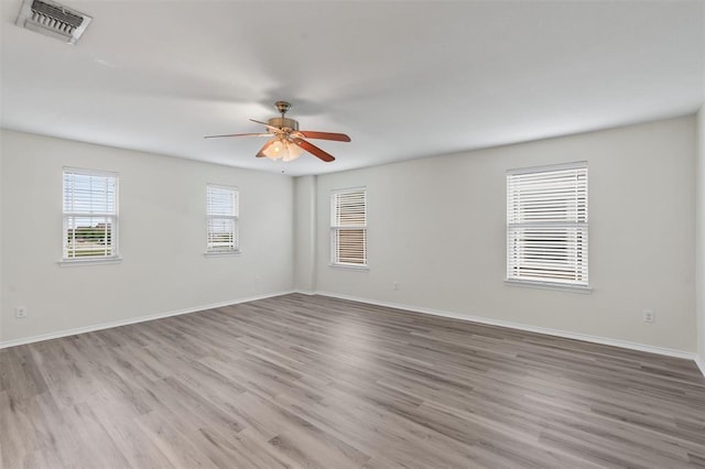 unfurnished room with light hardwood / wood-style flooring and ceiling fan