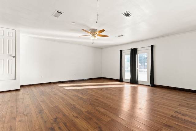 spare room with ceiling fan, ornamental molding, and hardwood / wood-style flooring